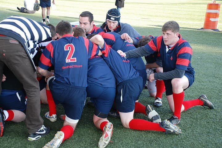 Sacred Heart Rugby forwards packed into a maul as the referee watches the contest for the ball.